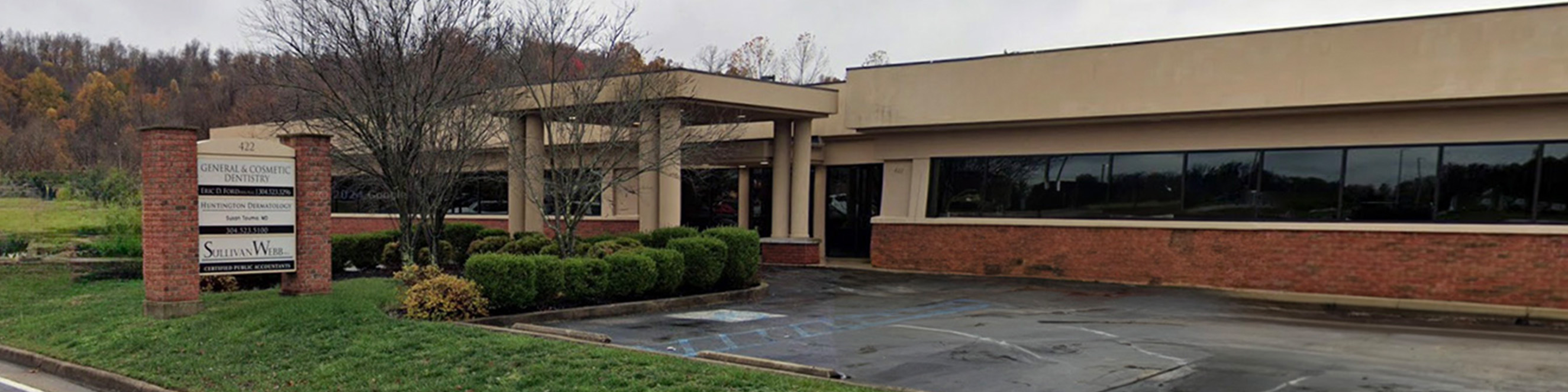 Exterior view of Huntington Dermatology office building in Huntington, WV, located in the Kinetic Park complex.